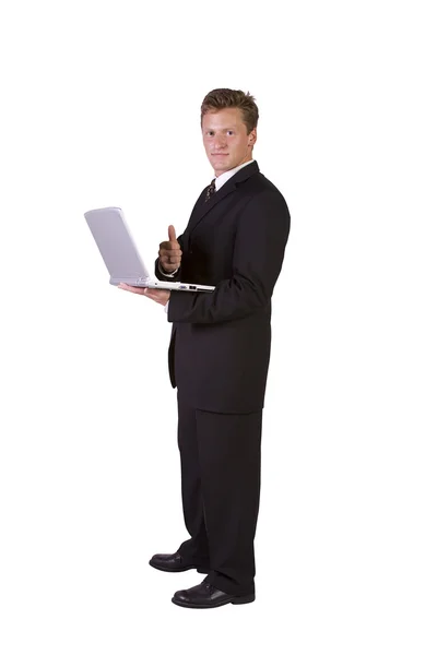 Uomo d'affari che lavora su laptop e gesticolare con i pollici in su — Foto Stock