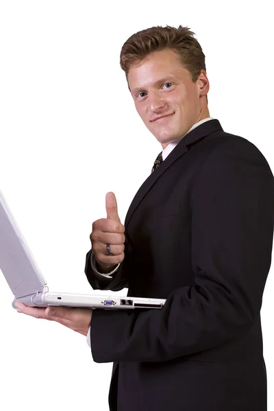 Zakenman die op laptop werkt en gebaren met duimen omhoog — Stockfoto