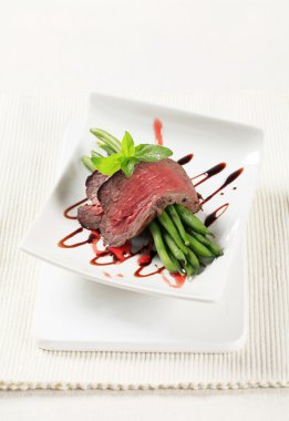 Roast beef and string beans clipart