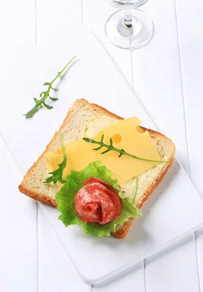 Bread with Swiss cheese and salami — Stock Photo, Image