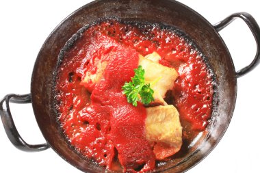 Pan fried fish fillets with tomato sauce