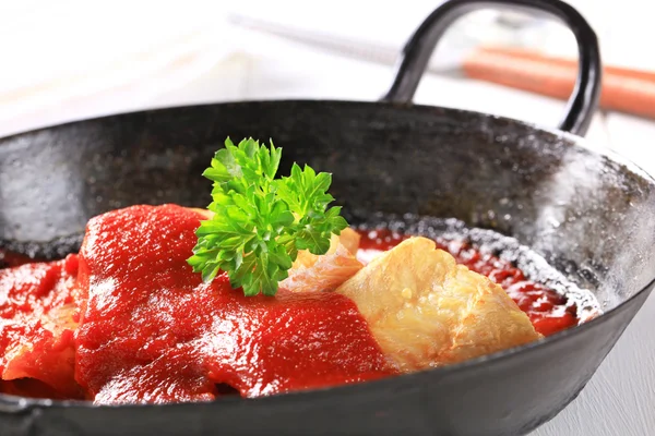 Pan fried fish fillets with tomato sauce — Stock Photo, Image