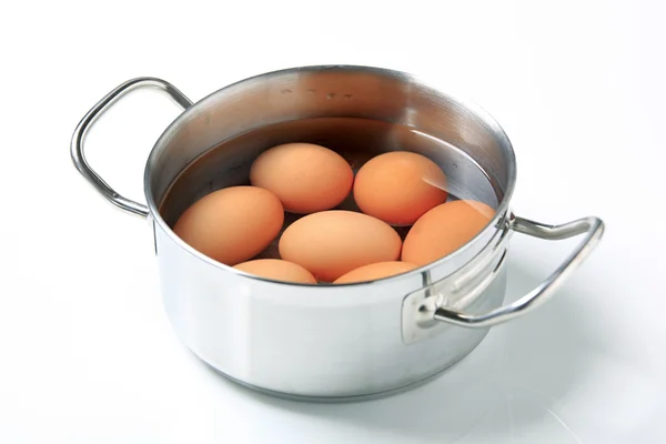 Eggs in a saucepan — Stock Photo, Image