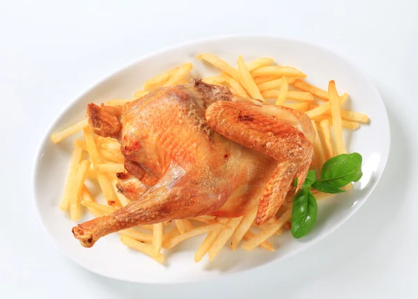 Roasted chicken with French fries — Stock Photo, Image