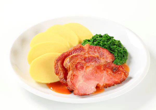 Smoked pork neck with potato dumplings and spinach — Stock Photo, Image