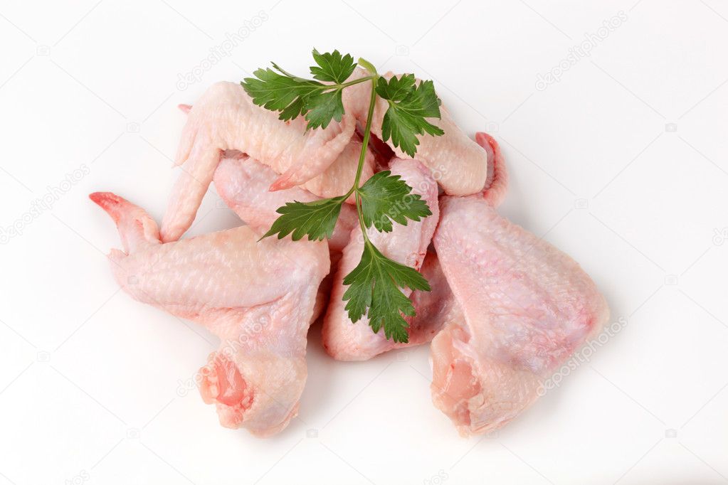 Alitas de pollo crudas fotos de stock, imágenes de Alitas de pollo crudas  sin royalties | Depositphotos