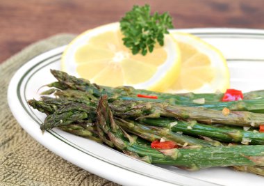 Roasted asparagus, macro with selective focus. clipart