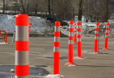 Colourful bollards in the parking lot clipart