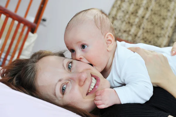 Baby with mother Stock Image