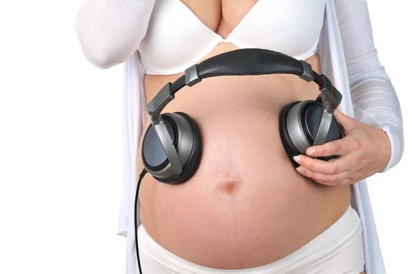 Future baby listens to music — Stock Photo, Image