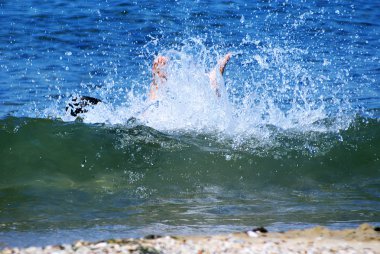 Legs drowning man sticking out of the water clipart