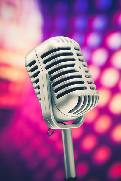 stock image Retro microphone on purple disco background