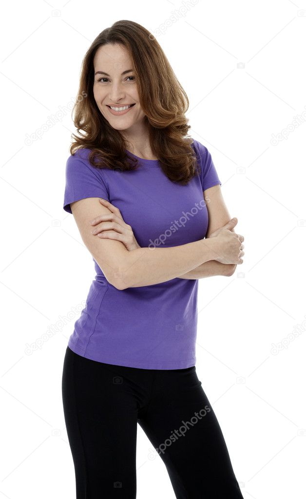Pretty Brunette Woman Standing with Arms Crossed on White