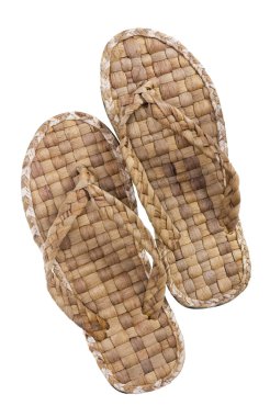 Summer footwear is weaved from straw clipart