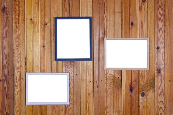 Pictures frames on pine wall — Stock Photo, Image