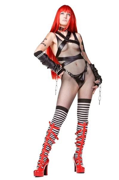 Sexy rothaarige Frau im Fetisch-Kostüm — Stockfoto