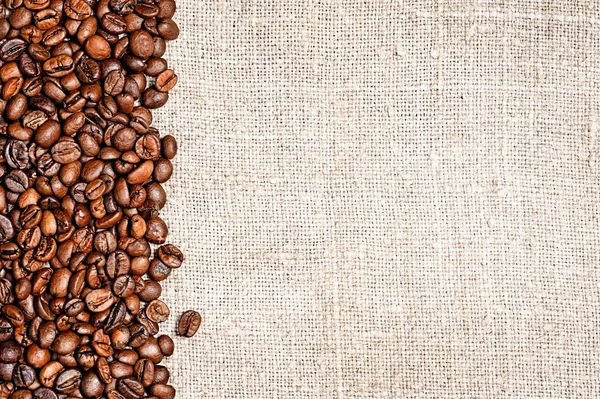 Grãos de café e pano de saco — Fotografia de Stock