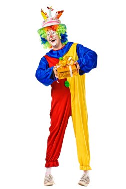 Happy birthday clown with a gift box clipart
