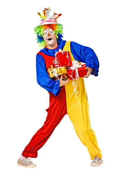 Birthday clown holding gift boxes — Stock Photo, Image