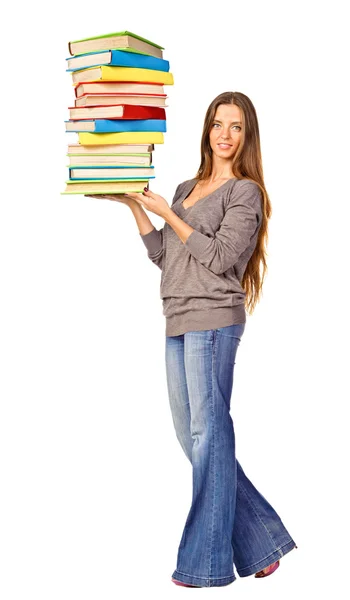Menina bonita segurando livros de cor pilha . — Fotografia de Stock
