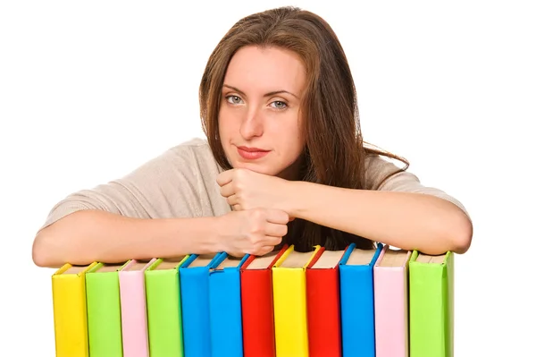 Dívka s knihou barevné hromádky — Stock fotografie