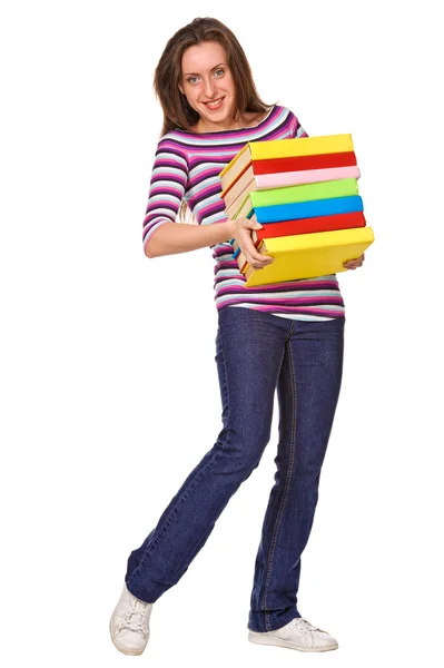 Счастливая студентка с кучей цветных книг — стоковое фото