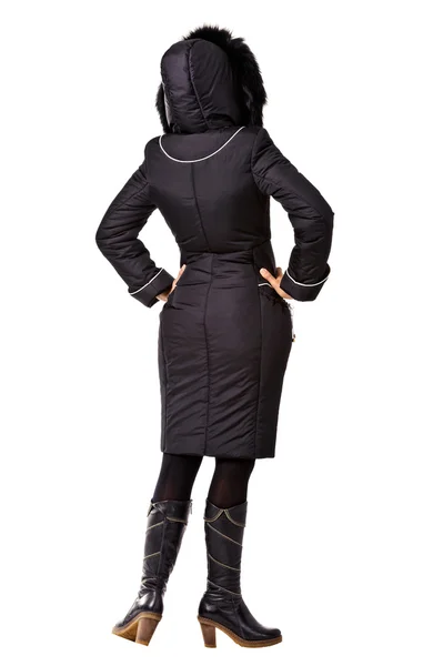 Rear view of woman in winter black hooded jacket on white backgr — Stock Photo, Image