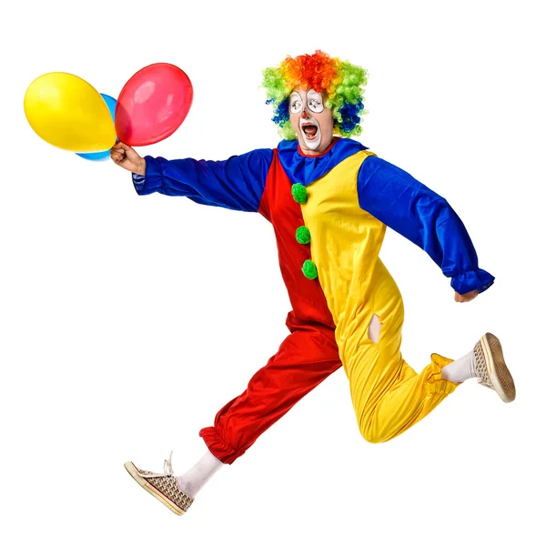Ritratto di un clown felice che salta con palloncini — Foto Stock