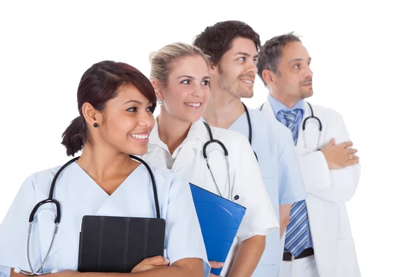 Group of doctors standing together over white — Stock Photo, Image