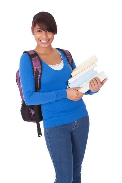 Retrato de una hermosa estudiante con libros —  Fotos de Stock