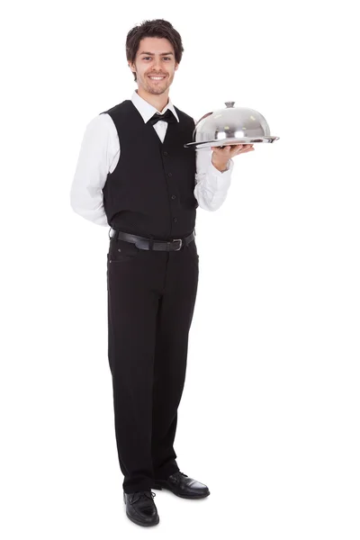 Portret van een butler met strikje en lade — Stockfoto