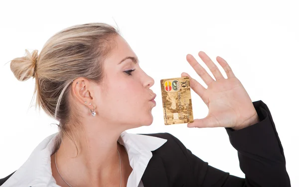 Businesswoman kissing credit card — Stok fotoğraf