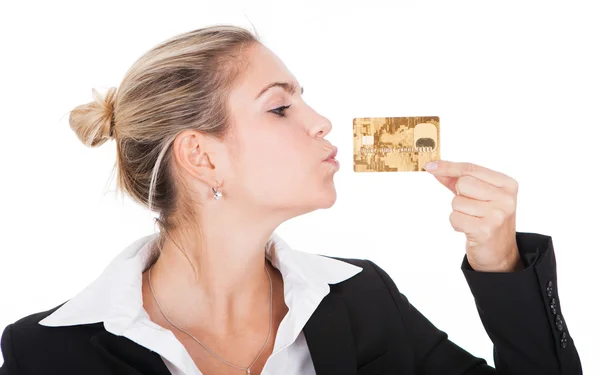 Businesswoman kissing credit card — Stockfoto