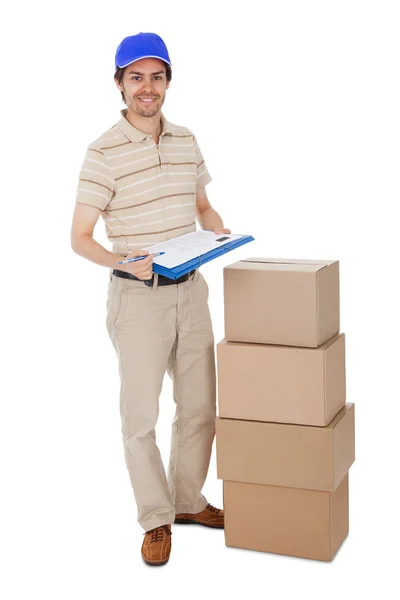 Delivery man asking to sign delivery confirmation — Stock Photo, Image