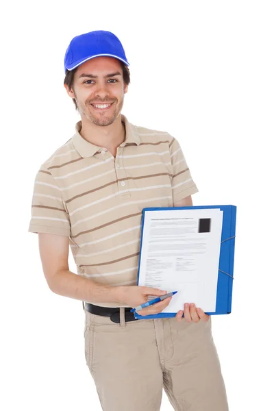 Delivery man asking to sign delivery confirmation — Stock Photo, Image