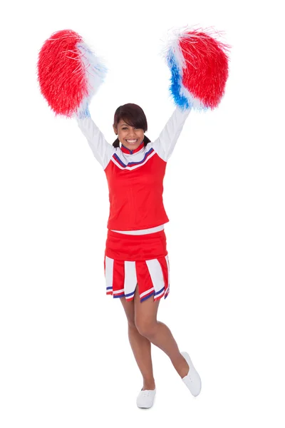 Ler vacker cheerleader med pompoms — Stockfoto