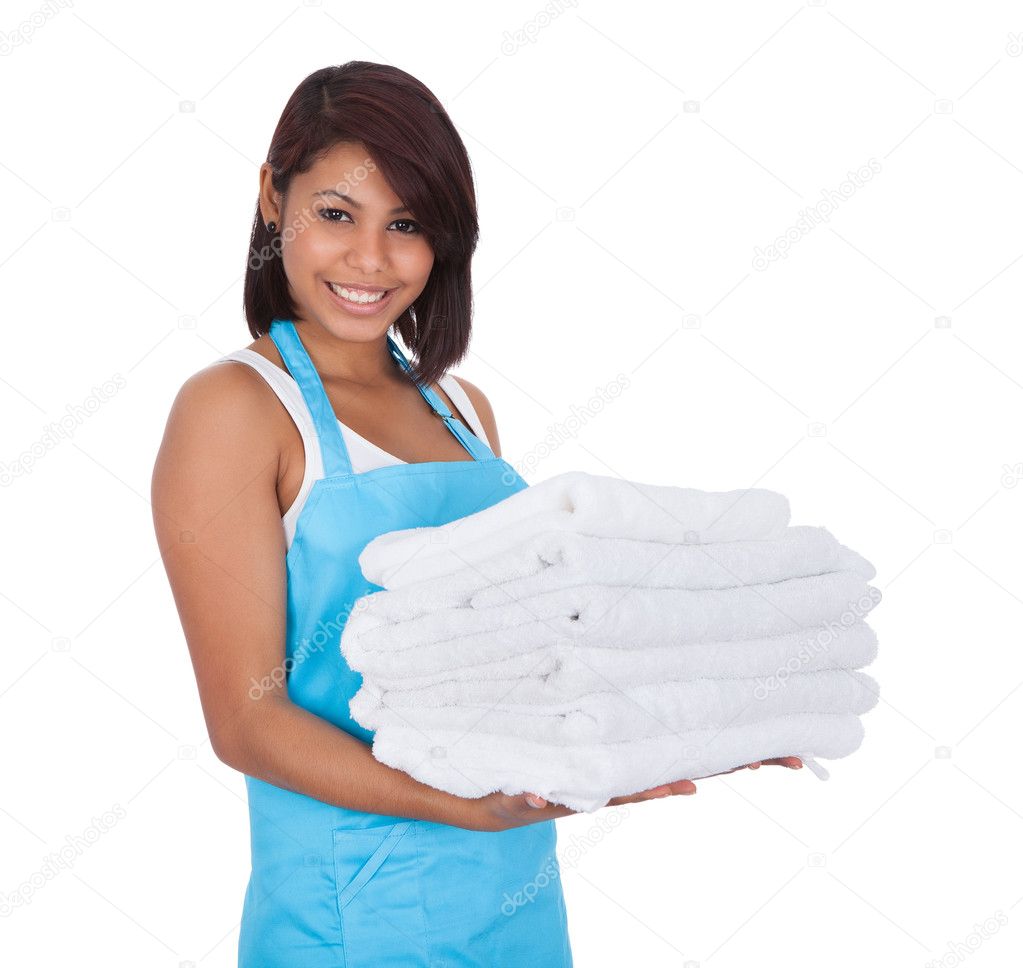 Smiling maid woman with towels