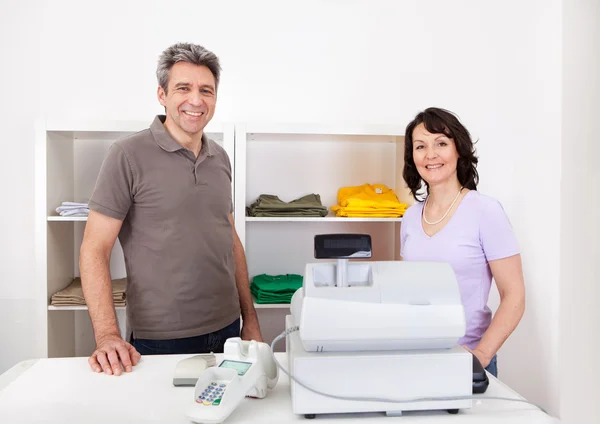 Two sales persons in the shop — Stock Photo, Image