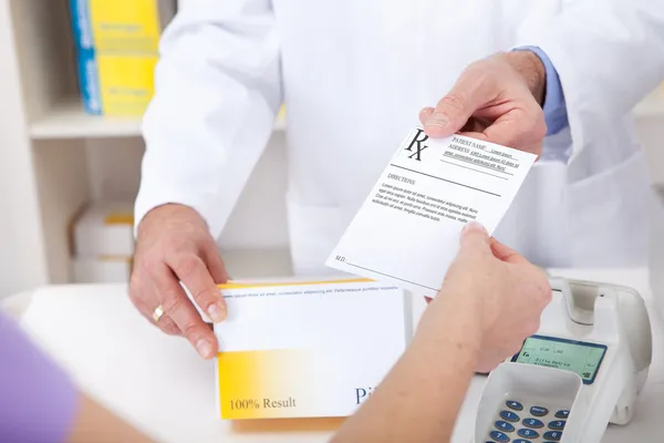 Buying prescription medicine at drugstore — Stock Photo, Image