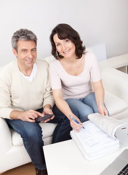 Mature couple doing family finances — Stock Photo, Image