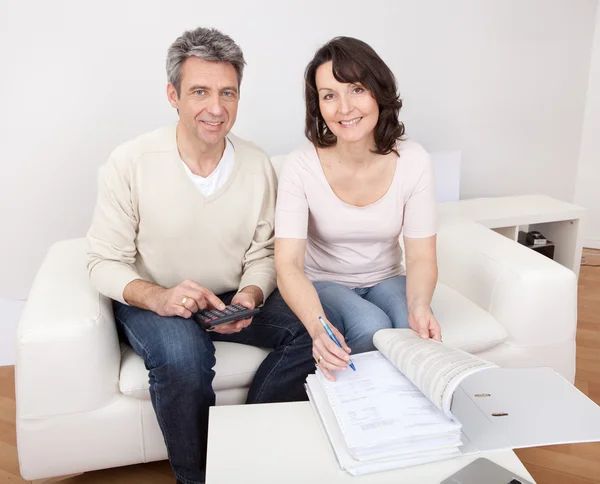 Mature couple doing family finances — Stock Photo, Image