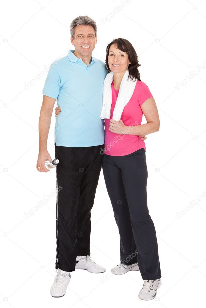 Active mature couple doing fitness
