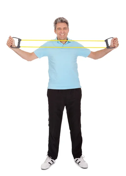 Active mature man doing exercises — Stock Photo, Image