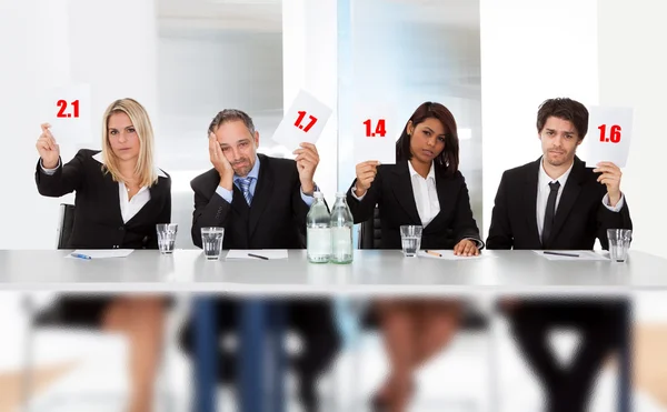 Panel judges holding bad score signs — Stock Photo, Image