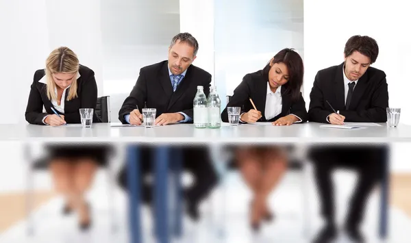 Business taking notes at the meeting — Stock Photo, Image