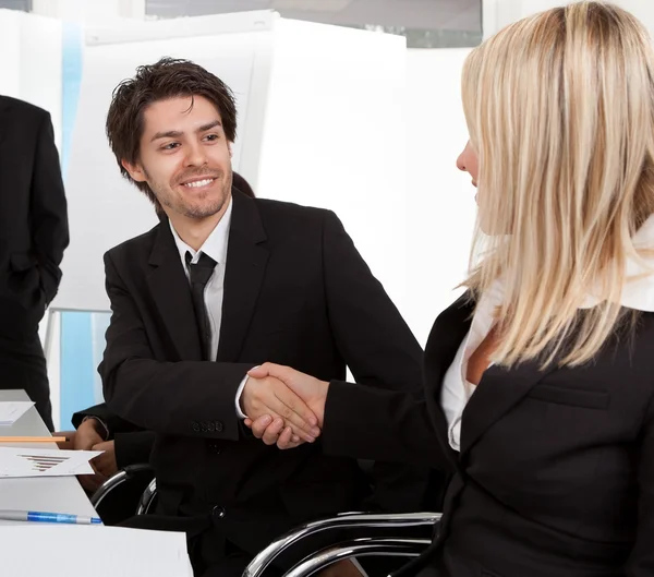 Businesspeople shaking hands in the meeting — Stock Photo, Image
