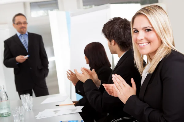 Businesswoman at presentation applauding — Stock Photo, Image
