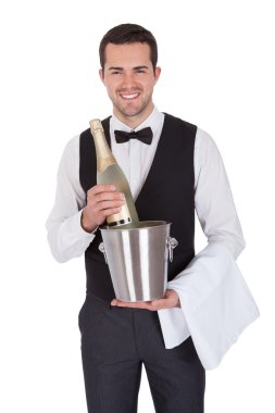 Portrait of a cheerful young butler clipart