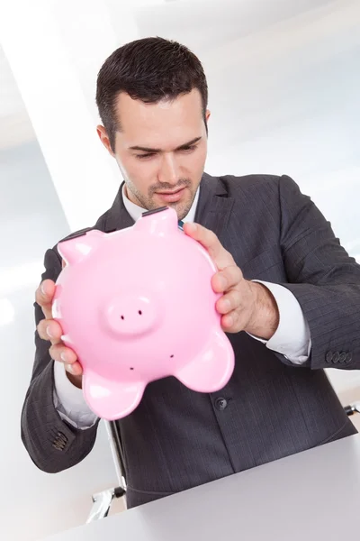 Businessman holding piggybank — Stock Photo, Image