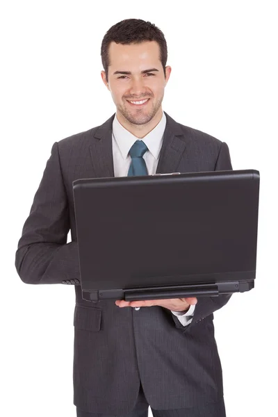 Porträtt av framgångsrik affärsman med laptop — Stockfoto